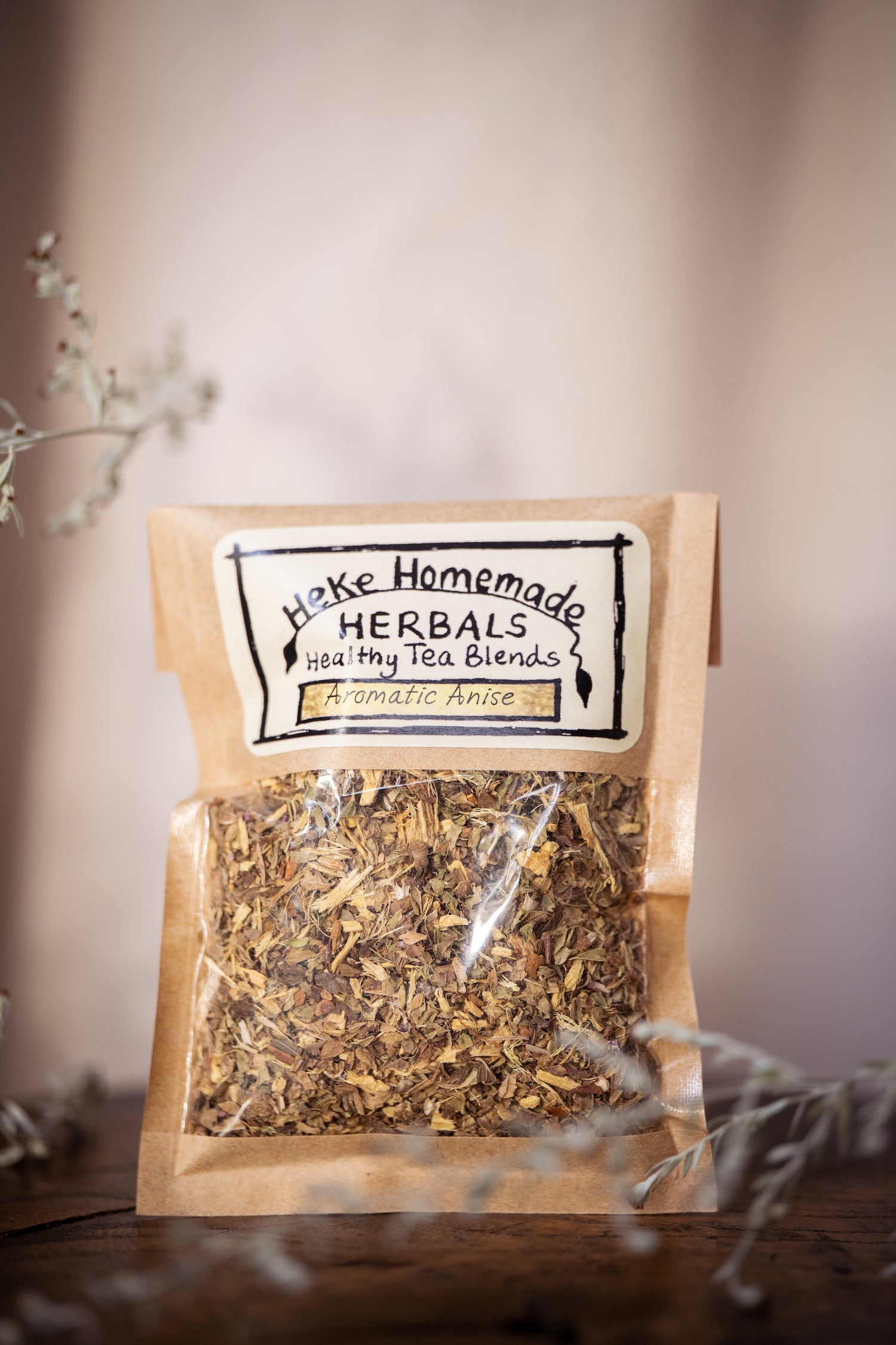 Packaged bag of Heke Herbal Aromatic Anise Tea with visible aniseed and fennel herbs.