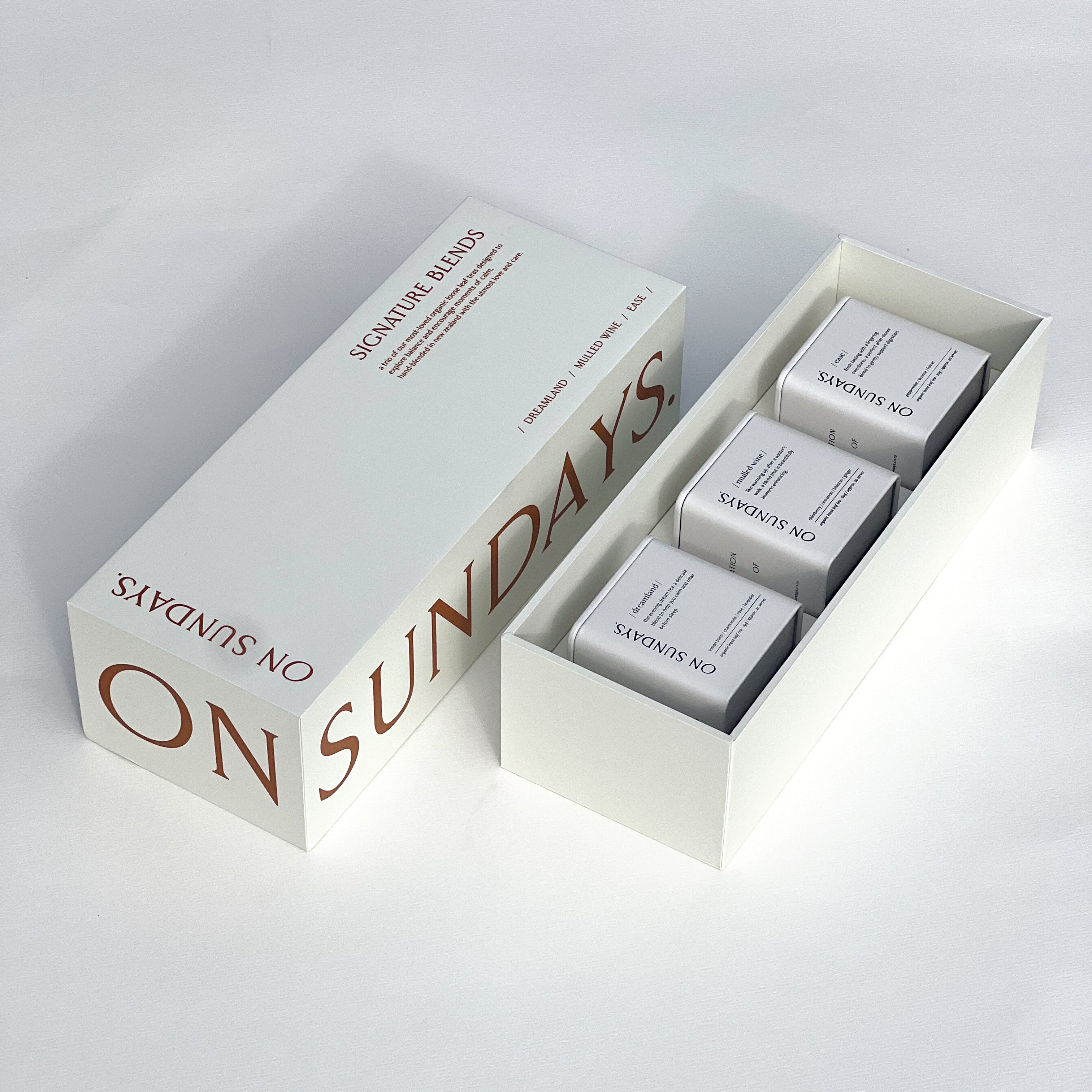 On Sundays signature blends gift set opened with three tins of tea sitting inside