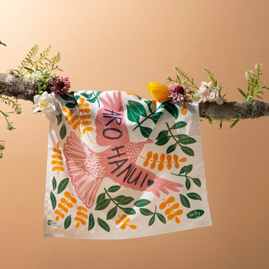 A HANK handkerchief being displayed hanging on a branch with flowers