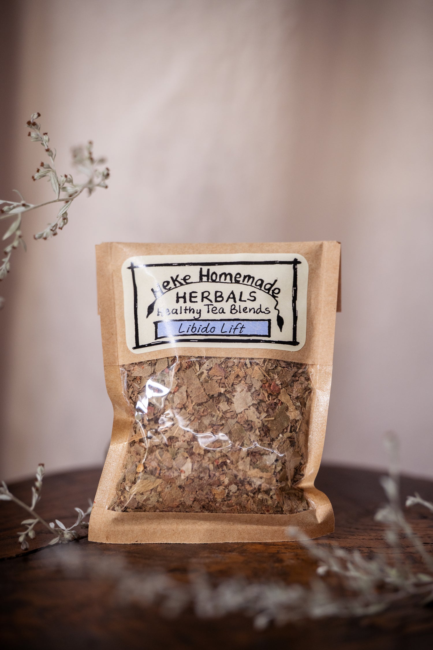 Packaged herbal tea blend from Heke Herbals, featuring a clear window showing the contents and labeled with the product name and brand.