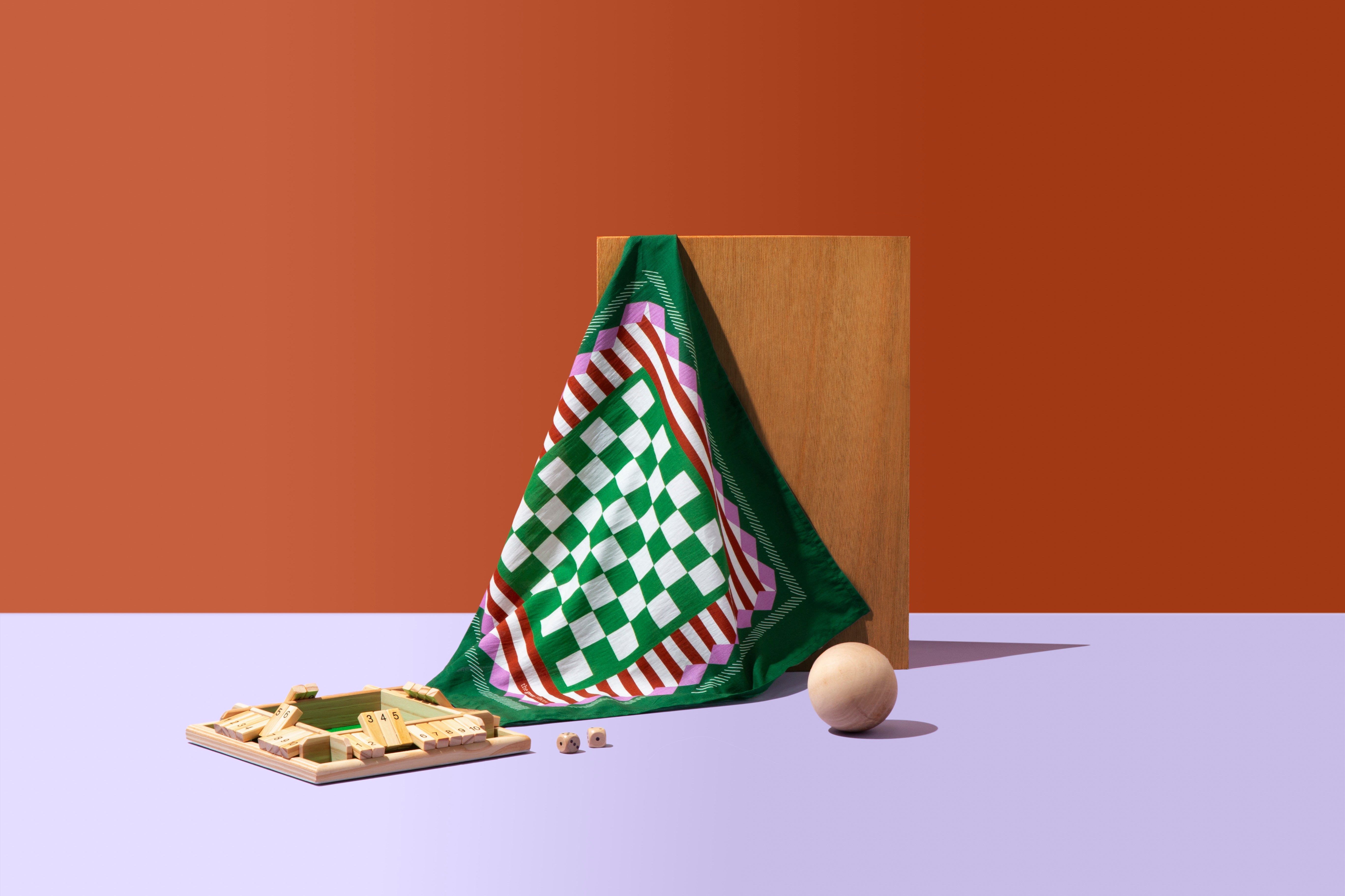 A HANK handkerchief displayed on an orange and white background