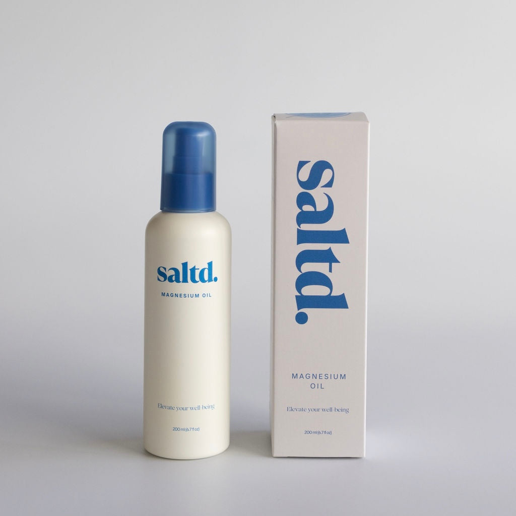 Saltd magnesium oil bottle and packaging on a white background