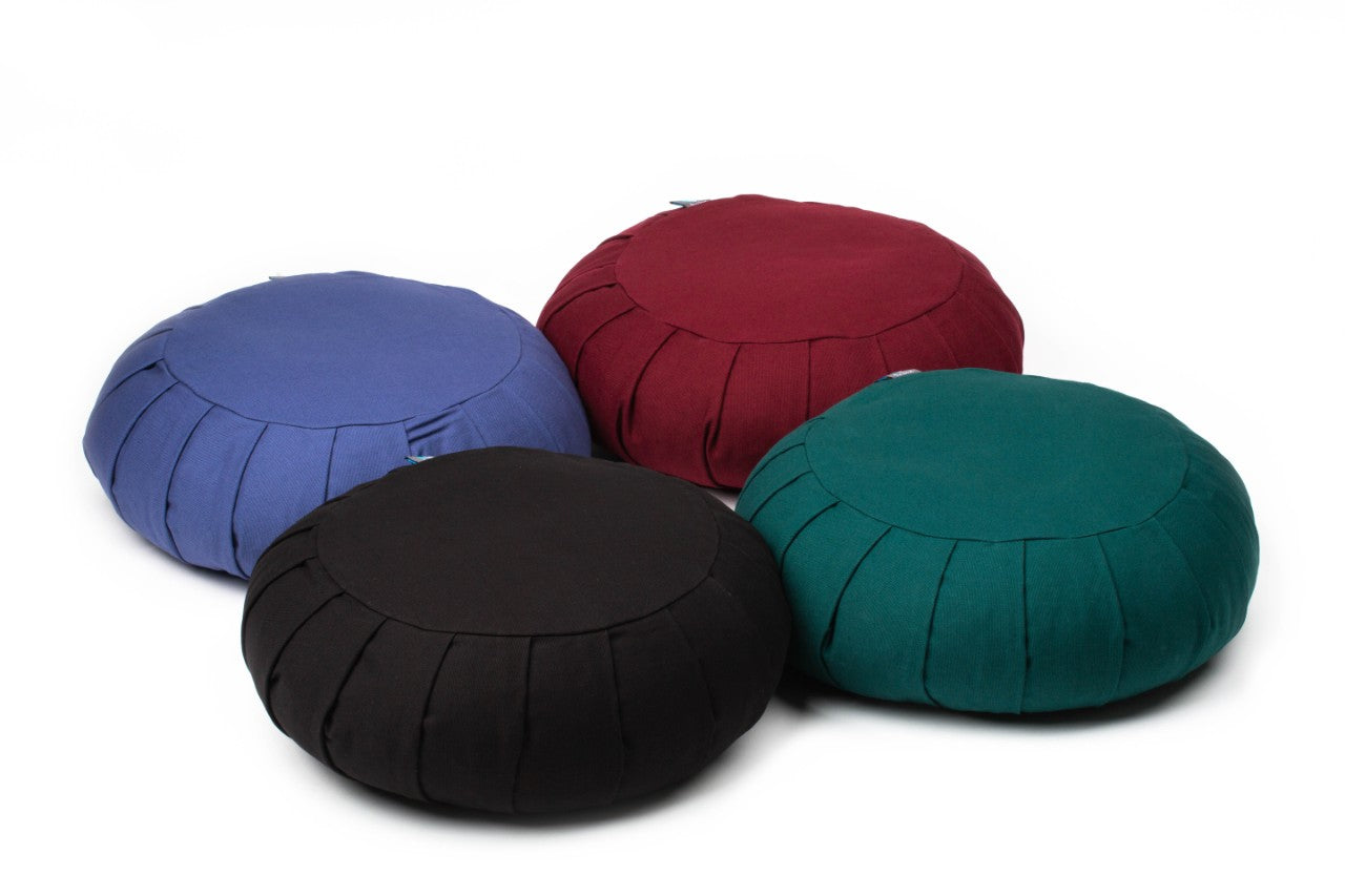 four zafu meditation cushions in cosmos, forest green, red and blue