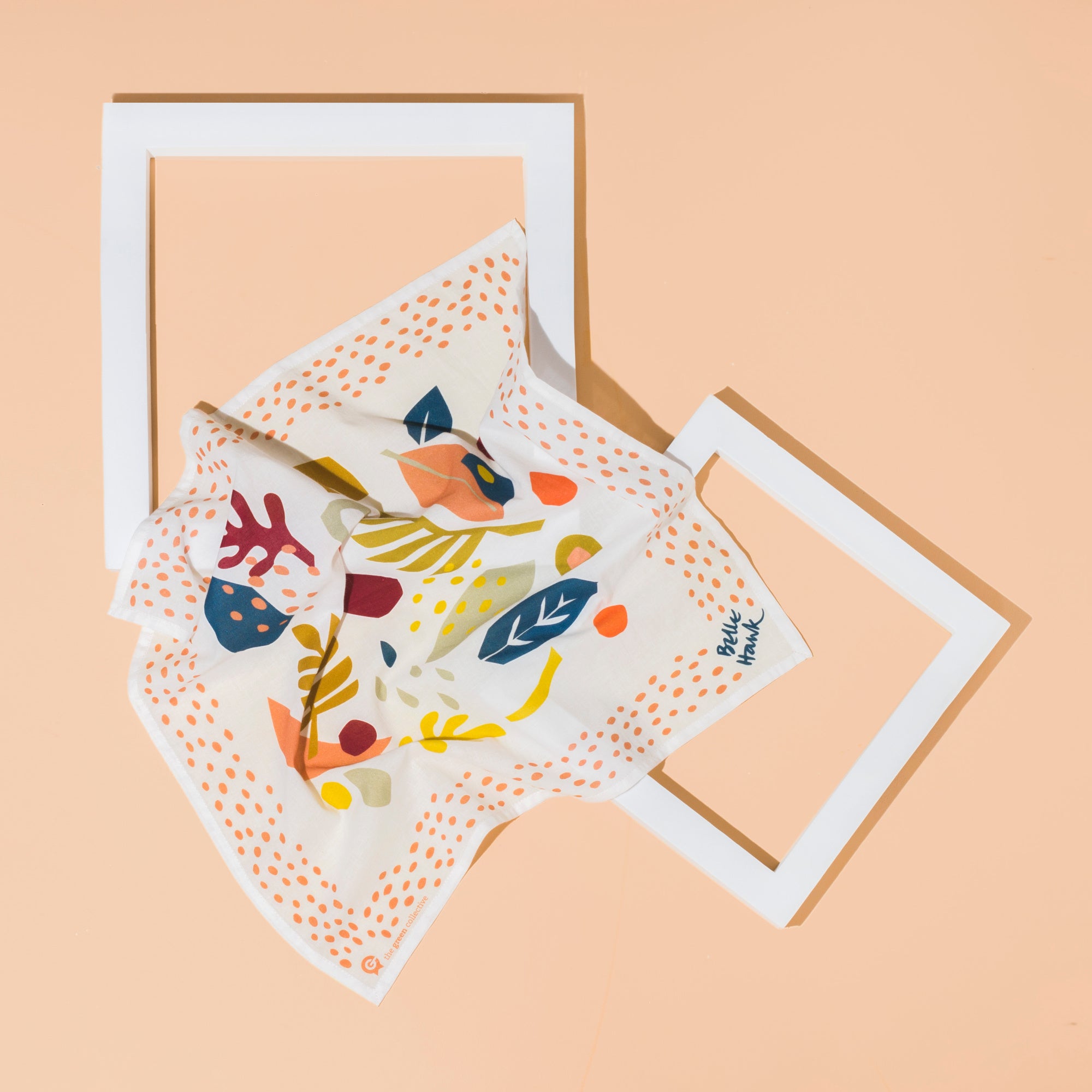 HANK handkerchief flat flay on a peach background