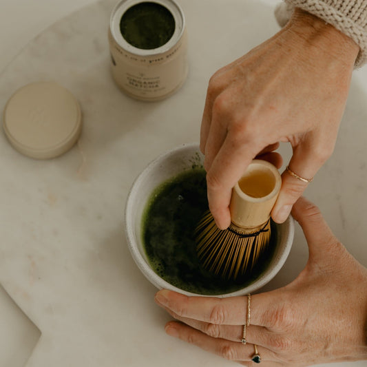 matcha being whisked in a bowl
