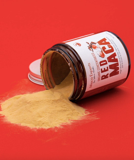seleno health red maca powder spilling out of a jar
