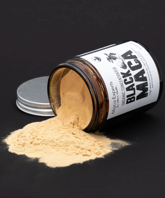 Seleno health black maca powder spilling out of a jar