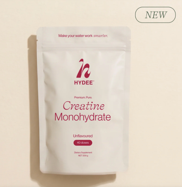 Creatine monohydrate packet on a cream background