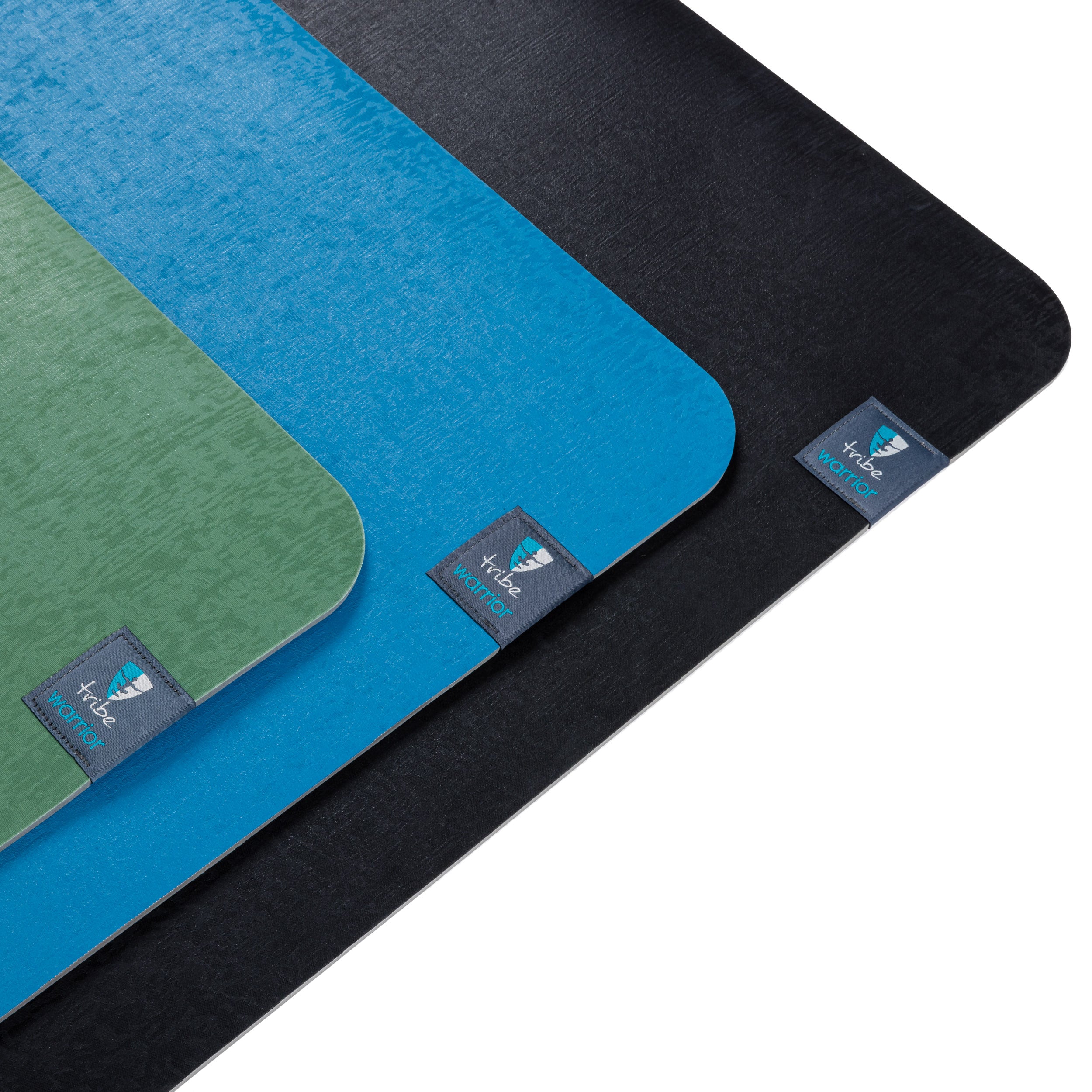 Three Tribe Warrior 6mm yoga mats in black, blue, and green with a brand logo on a white background